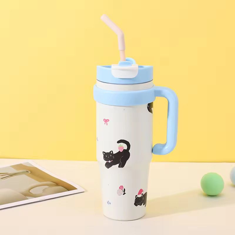 1000ml Stainless Steel Insulated TumblerTumblersCRAFTY CUDDLEWhite tumbler with blue lid and handle, featuring black cat illustrations on a yellow background.Sky BlueInsulatedTumbler StainlessSteelMug TravelTumbler 1000mlBottle VacuumFlask HotAndColdBottle BPAFree CoffeeOnTheGo CarCupHolderFriendly ReusableDrinkware