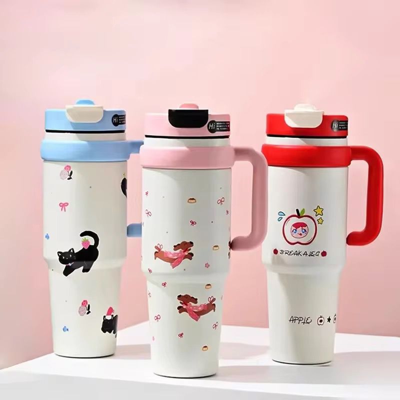 1000ml Stainless Steel Insulated TumblerTumblersCRAFTY CUDDLEThree colorful travel mugs with cartoon designs on a pink backgroundPinkInsulatedTumbler StainlessSteelMug TravelTumbler 1000mlBottle VacuumFlask HotAndColdBottle BPAFree CoffeeOnTheGo CarCupHolderFriendly ReusableDrinkware