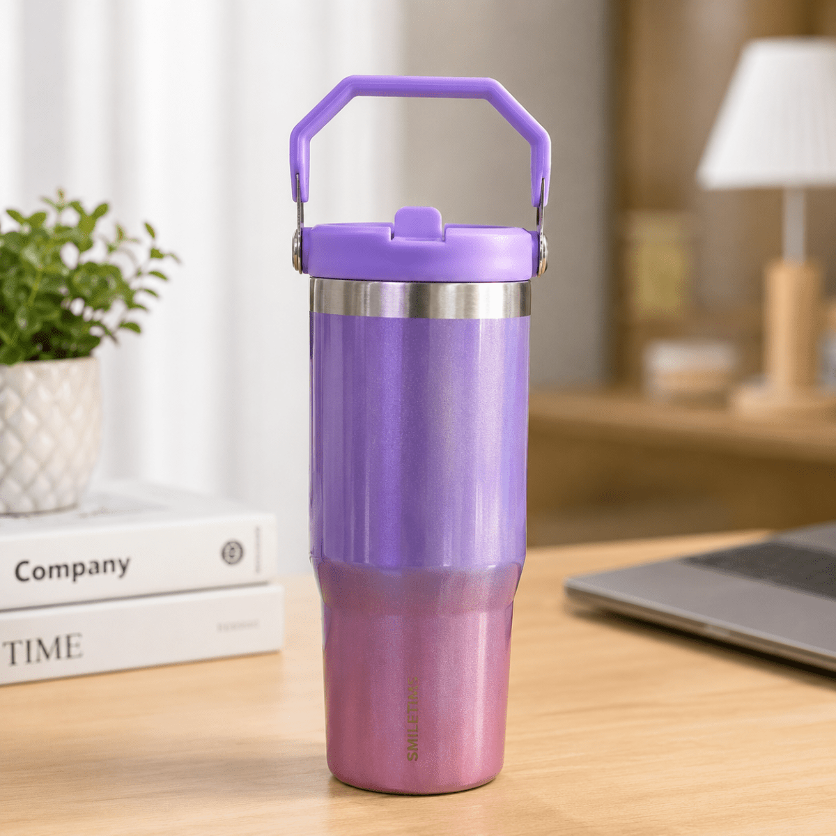 900ml Stainless Steel Insulated Tumbler with HandleInsulated Water BottleCrafty CuddlePurple insulated tumbler on a desk with books and a laptop in the backgroundPurpleStainlessSteelTumbler 900mlTumbler TravelMug StrawSipper InsulatedBottle LeakproofBottle BPAFree HydrationOnTheGo CupHolderFriendly TravelEssentialsStationeryAddict