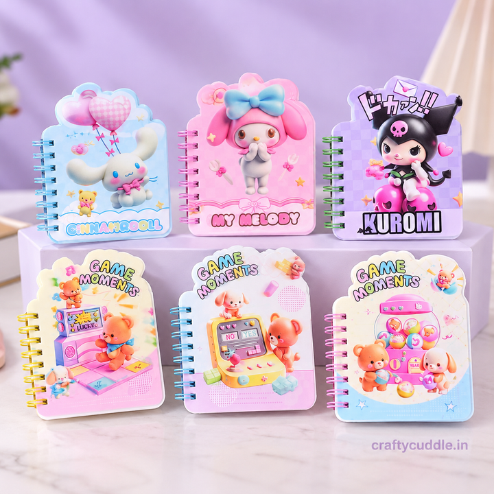 Six small spiral-bound notebooks with colorful cartoon covers arranged on a white pedestal against a soft lavender background. The covers feature characters including My Melody, Kuromi, and a bear playing with a game console, with text such as &