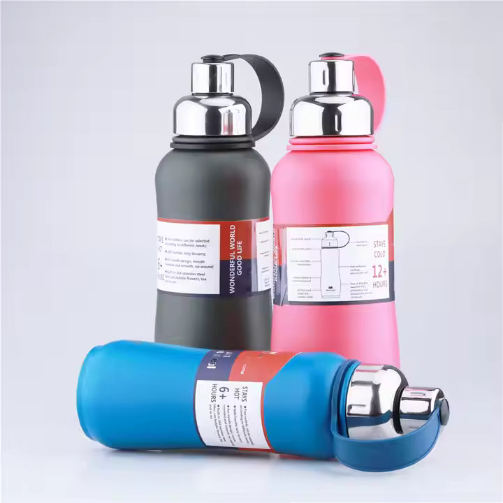 Three insulated bottles in black, pink, and blue on a light gray background