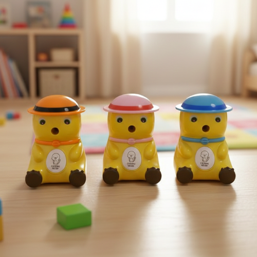 Three colorful bear-shaped sharpeners with hats on a wooden surface.