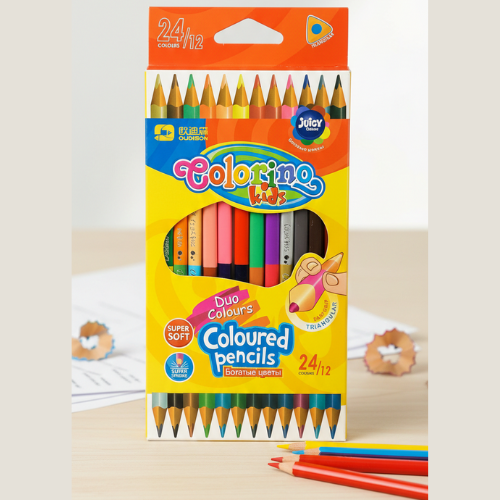Box of Coloring Kids colored pencils with pencils partially visible on a light background