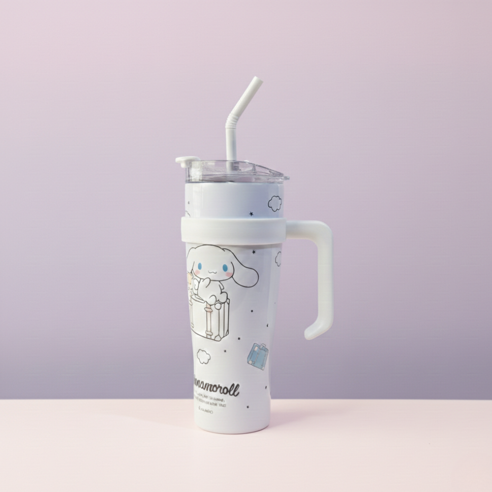 White tumbler with cartoon character design on a light purple background