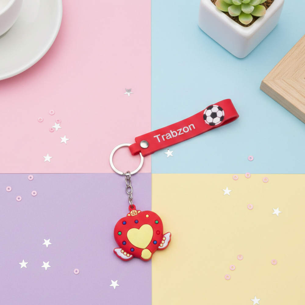 Red keychain with heart design and &