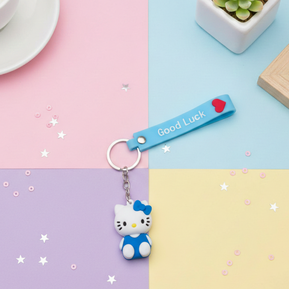 Hello Kitty keychain with 'Good Luck' tag on a colorful background