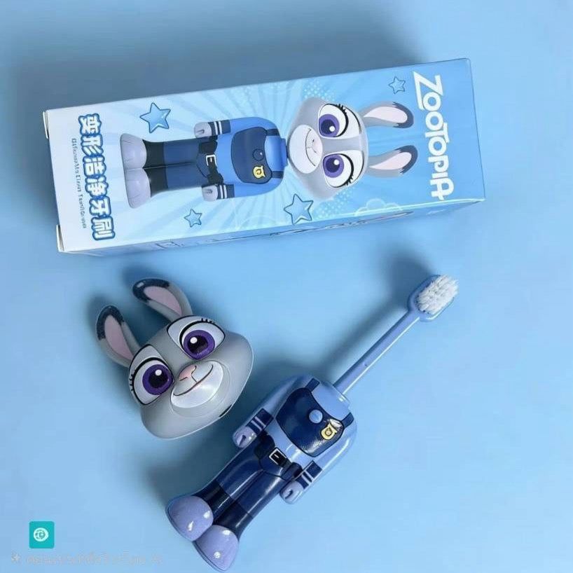 Children's cartoon-themed toothbrush and packaging on a blue background