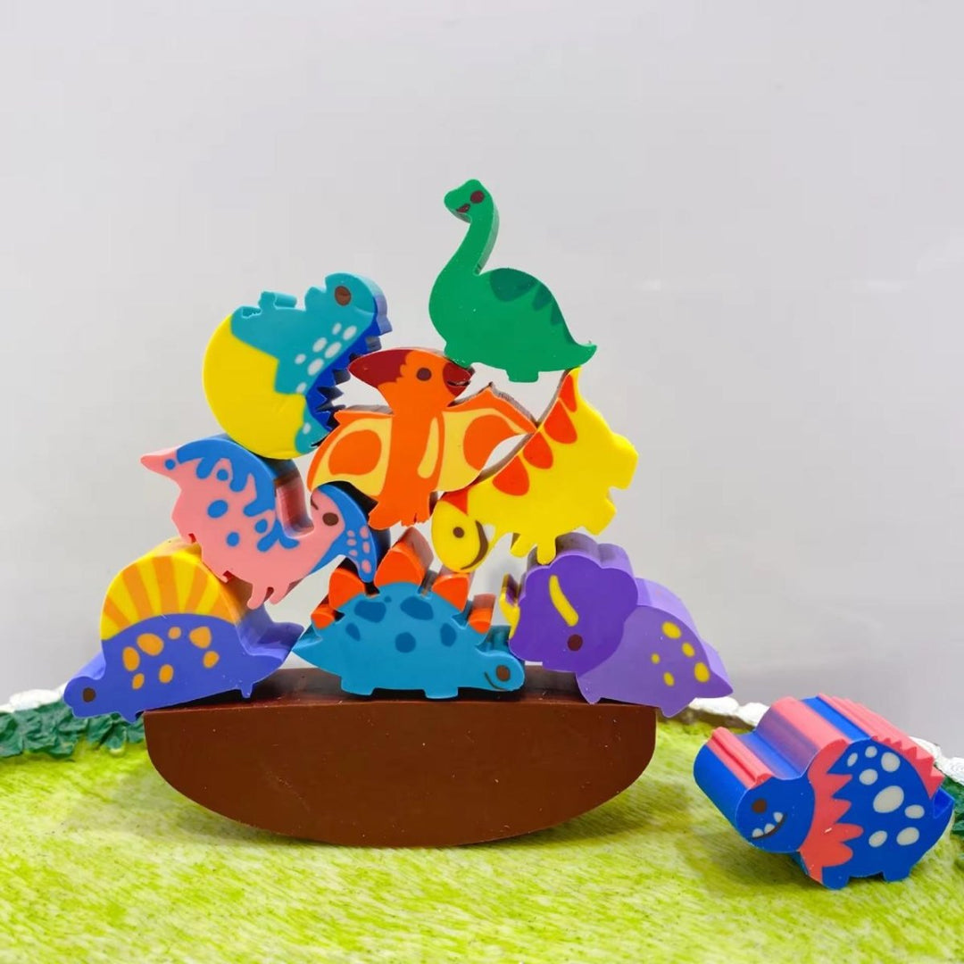 Colorful dinosaur erasers on a green base with a plain background