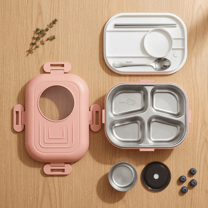 Big Size 4 - Compartment Stainless Steel Lunch BoxStainless Steel Lunch BoxCrafty CuddlePink lunch box with compartments and accessories on a wooden surfaceLunchBox BentoLunchBox LunchBoxForKids SchoolLunchBox StainlessSteelLunchBox LunchBoxWithCompartments HealthyLunch MealPrepBox KidsLunchBox TiffinBox