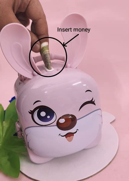 Pink rabbit-shaped money box with a hand inserting money into it on a pink background.