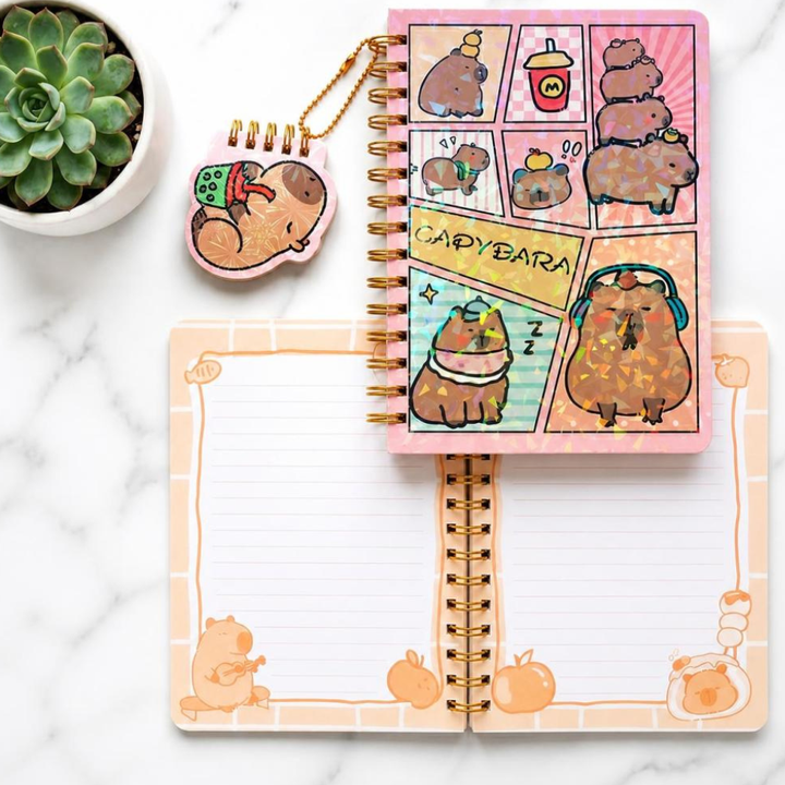 Capybara Spiral Diary with Mini Keychain NotebookDiaryCrafty CuddleNotebook with capybara illustrations on a marble surfaceCapybaraDiary KawaiiStationery CuteNotebook AestheticStationery SpiralDiary KidsStationery JournalLover StationeryAddict KawaiiNotebook CuteSchoolSupplies