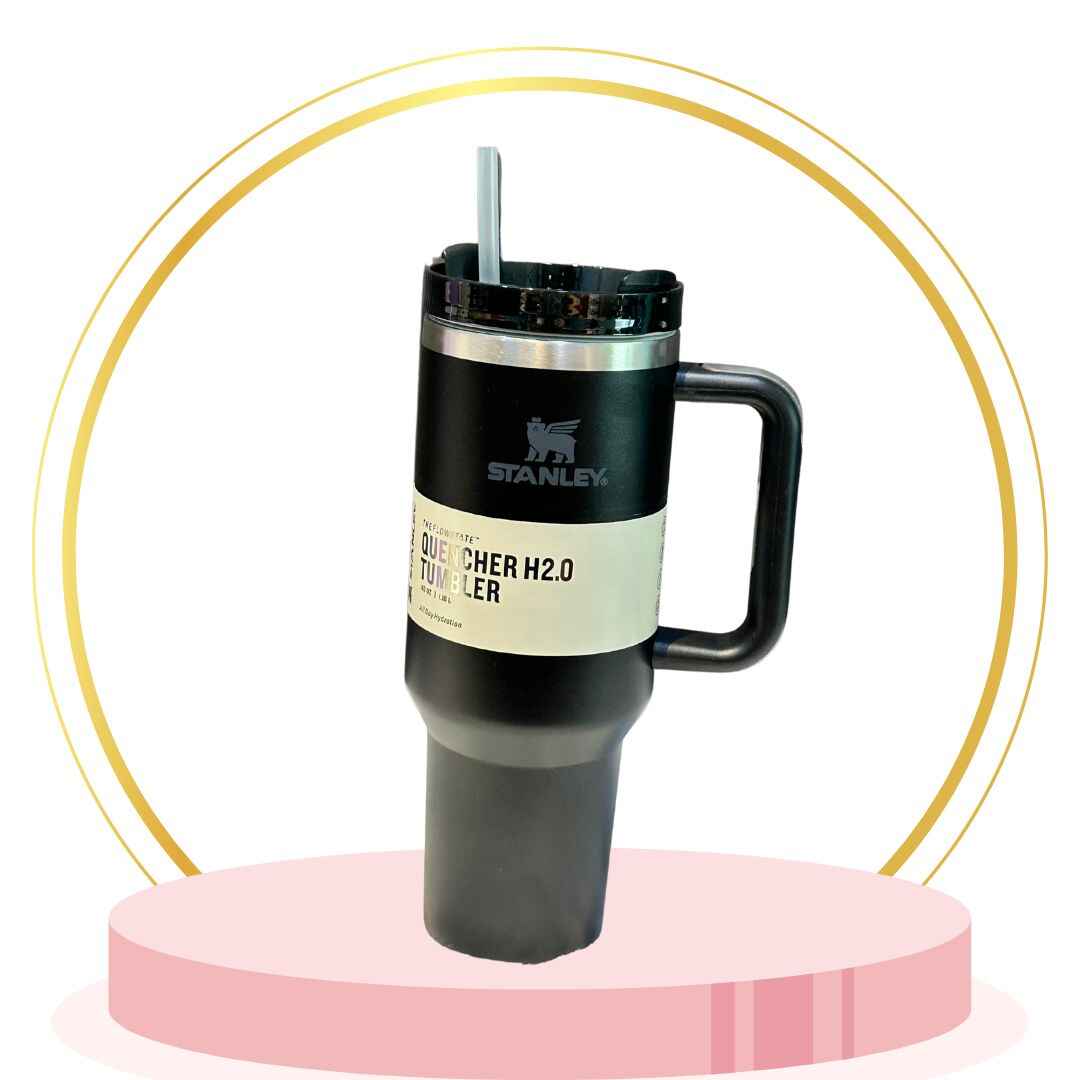 Matte black 20 oz stainless steel Stanley tumbler with straw and vacuum double-wall insulation for hot & cold drinks.