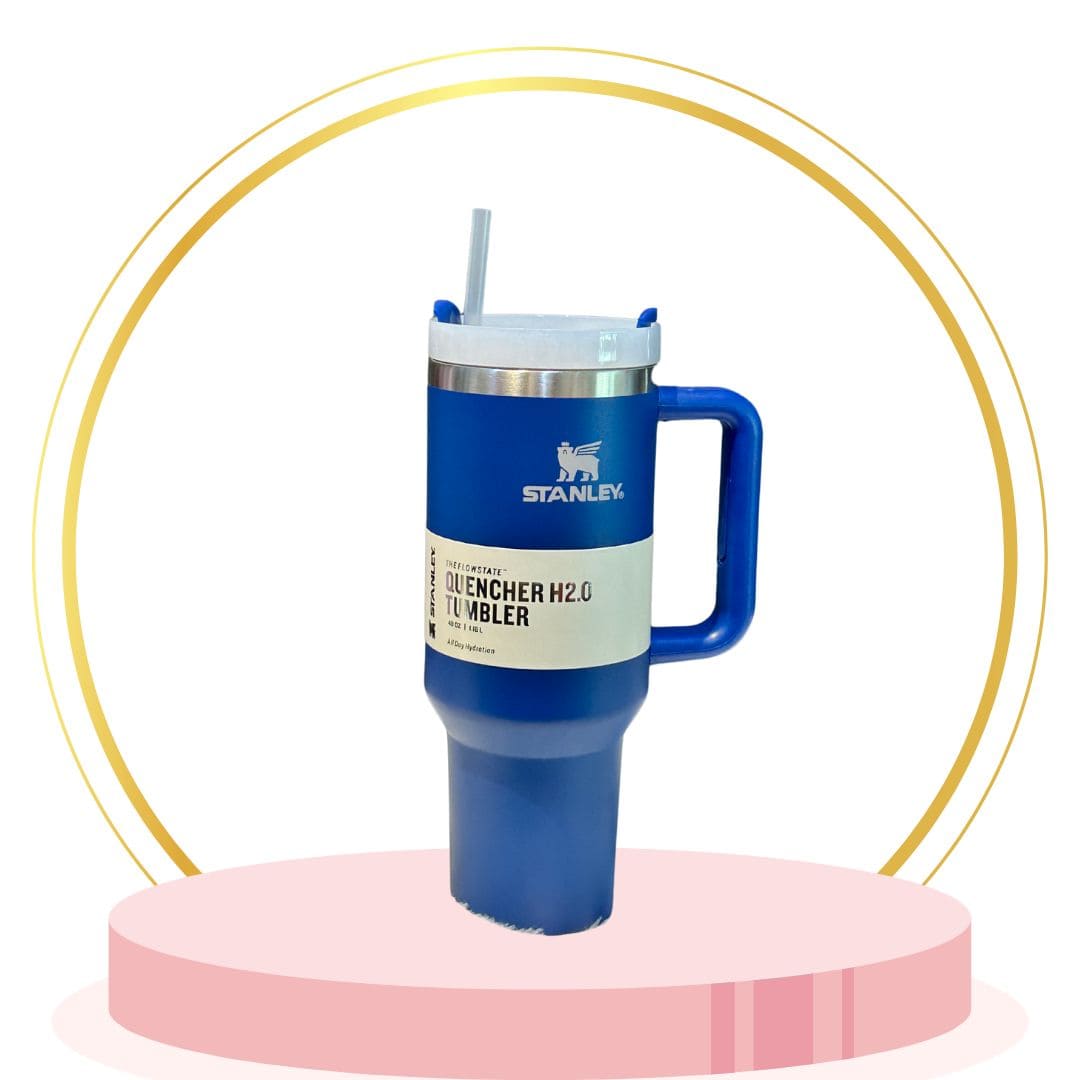 Navy blue 18 oz stainless Stanley tumbler with straw lid, double-wall insulation, perfect for commuting.