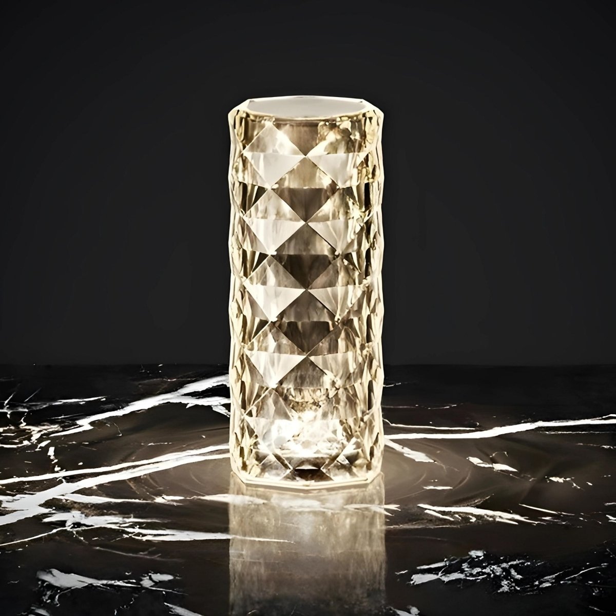 Decorative glass vase with geometric pattern on a dark surface