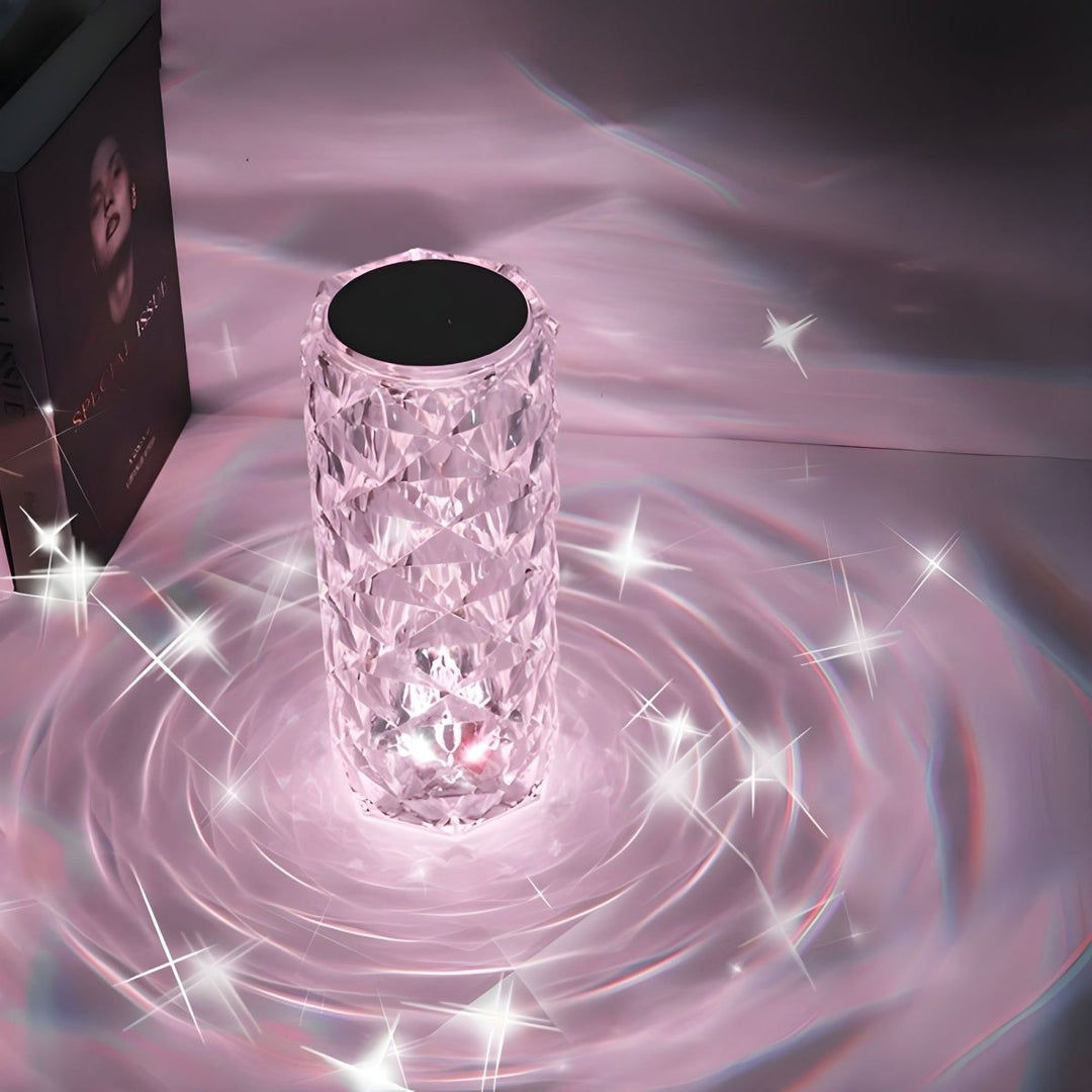 Crystal-like cylindrical object with sparkling effects on a pinkish background