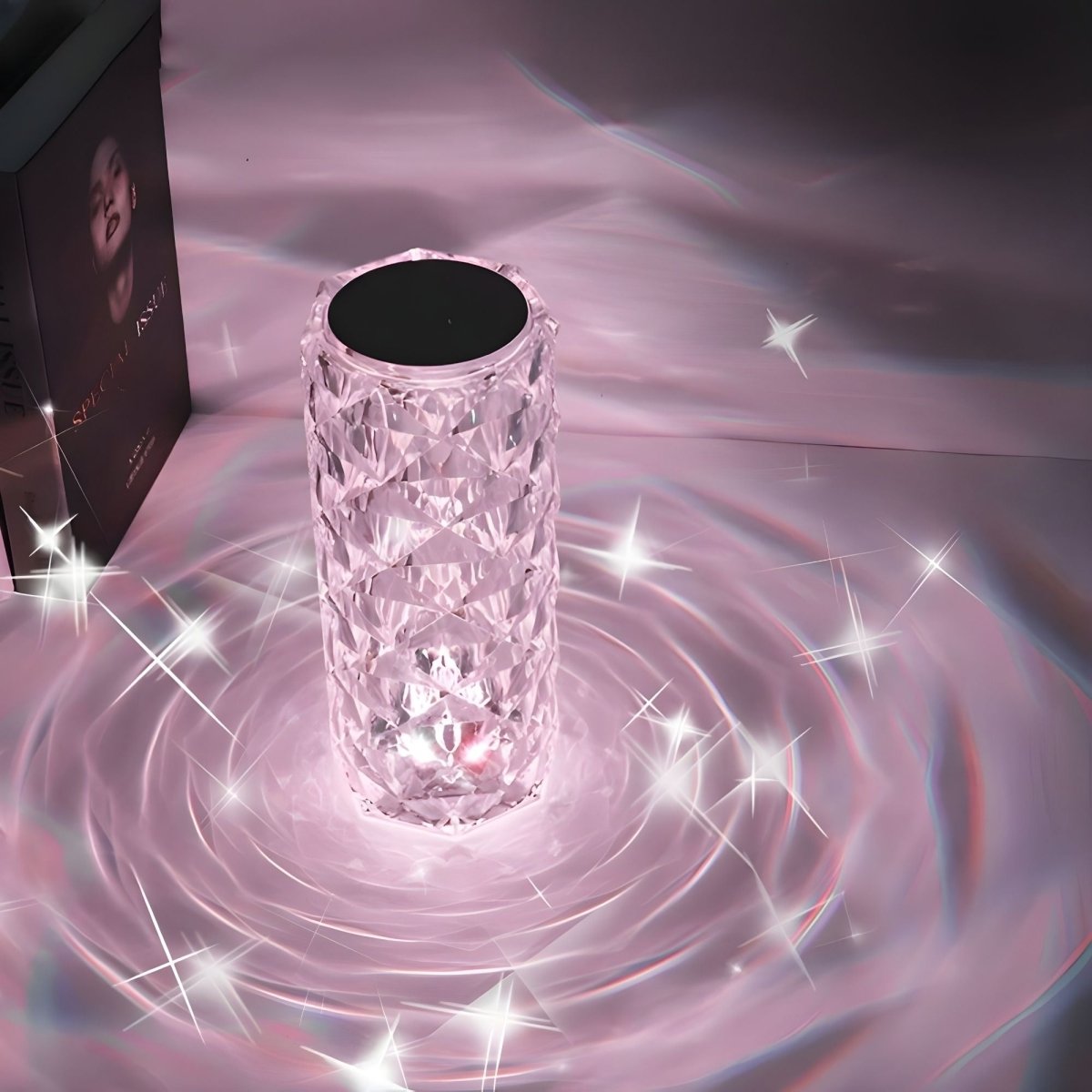 Crystal-like cylindrical object with sparkling effects on a pinkish background