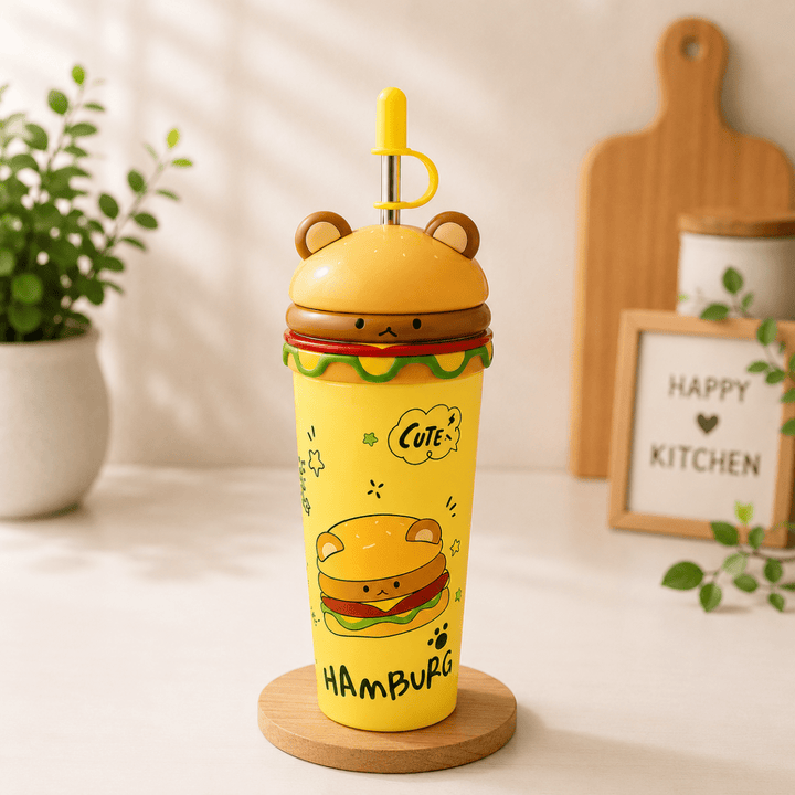 Cute Burger Stainless Steel Sipper CupSipper for kidsCrafty CuddleA cute yellow hamburger-themed tumbler cup with a matching lid and straw, styled on a wooden coaster in a warm kitchen setting.Yellowstainless steel cupburger sipper cup