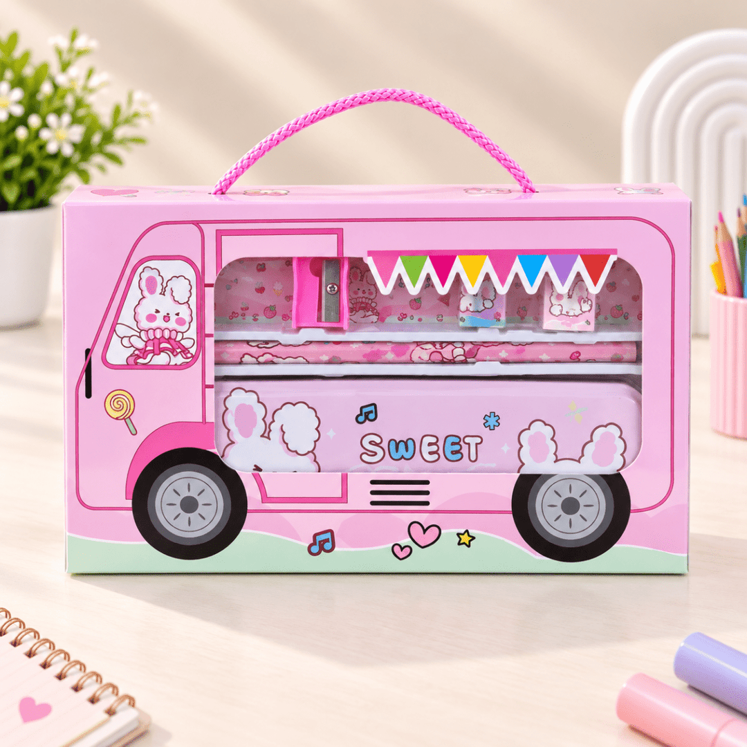 Cute Bus Design School Stationery SetKids Stationery SetCrafty CuddleA pink toy or stationery box shaped like a cute bus, with a rope handle, cartoon bunny graphics, and the word "SWEET" on the side, photographed on a light tabletop with small desk props around it.Pink