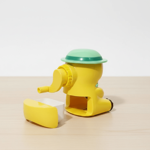 Cute Cartoon Manual Pencil SharpenerStationery > Erasers &amp; SharpenersCRAFTY CUDDLEYellow and green toy sharpener on a beige surface with a white backgroundKidsStationery CuteStationery SchoolSupplies PencilSharpener CartoonStationery BackToSchool StationeryAddict StudyEssentials ReturnGifts StationeryLovers