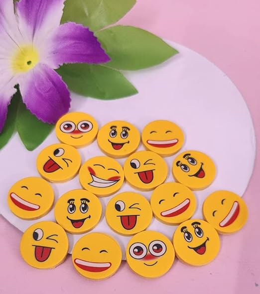 Set of yellow smiley face erasers on a pink background with a purple flower.