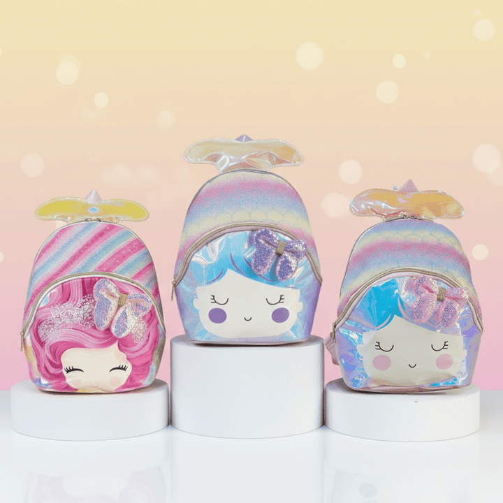 Cute Mermaid Mini Backpack for GirlsKids BagsCRAFTY CUDDLEThree colorful character - themed bags on white cylindrical stands with a soft pink backgroundPinkMermaidBackpack CuteKidsBag GirlsBackpack MiniBackpack HolographicBag GlitterBackpack PastelAesthetic KidsFashion ToddlerBackpack BackToSchool GiftForGirls UnicornVibes CuteAccessories KidsTravelBag TrendyKids