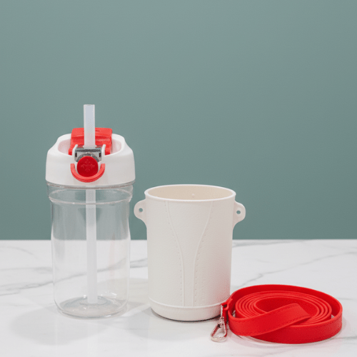 Defender 520mL Insulated BottleInsulated Water BottleCRAFTY CUDDLEClear water bottle with red accents and a white container on a light gray backgroundCream520mlbottledefenderbottle