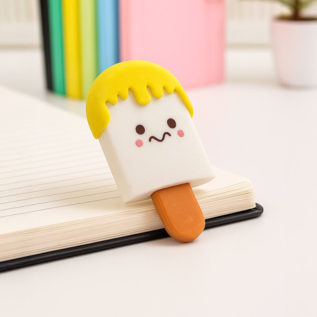 Cute ice cream popsicle-shaped bookmark with a face on an open book