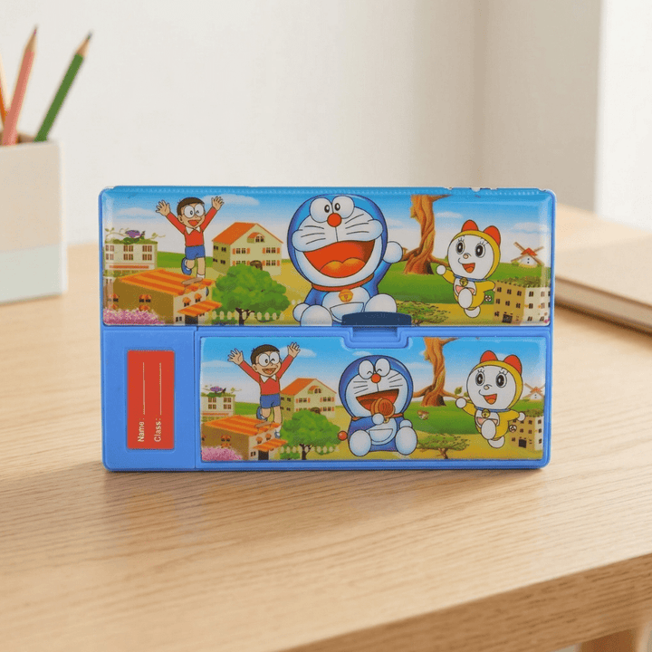 Doraemon Theme Multi - Compartment Pencil BoxPencil BoxCrafty CuddleColorful cartoon - themed pencil case on a wooden surfaceDoraemonStationery KidsPencilBox CartoonPencilCase SchoolSuppliesIndia StationeryLovers KidsSchoolEssentials PencilBoxOrganizer CuteStationery BackToSchoolIndia ReturnGiftIdeas