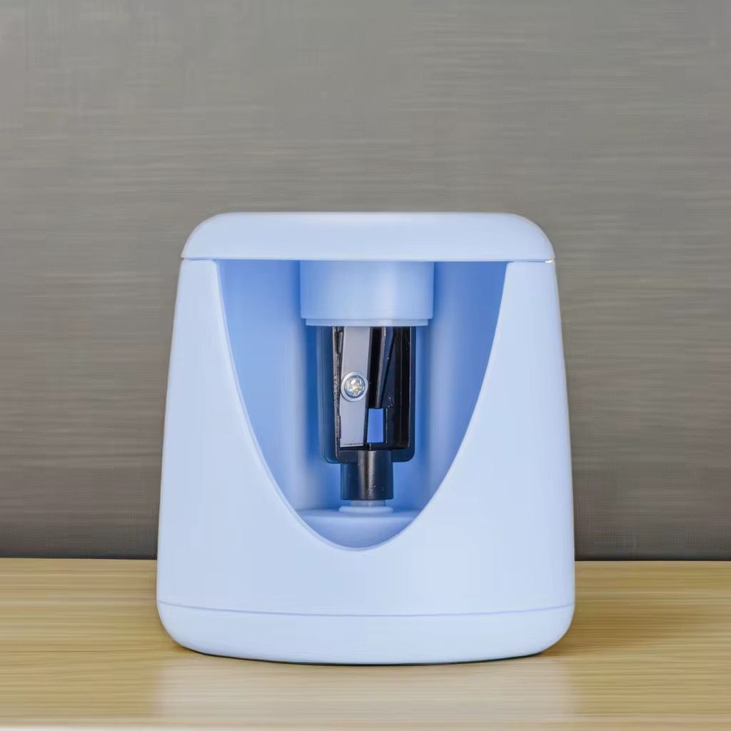 Electric Pencil SharpenerStationery > Erasers & SharpenersCRAFTY CUDDLEBlue pencil sharpener on a wooden surface with a gray backgroundBlueElectricSharpener StationeryEssentials SchoolSupplies StudyDesk OfficeSupplies BackToSchool SmartStationery DeskSetup StudentEssentials StationeryAddict