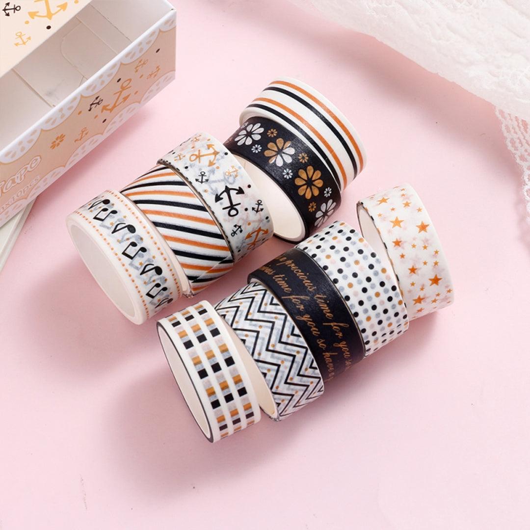 Set of 10 black and gold washi tape rolls in elegant patterns
