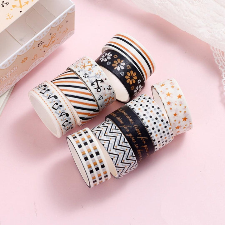 Set of 10 black and gold washi tape rolls in elegant patterns