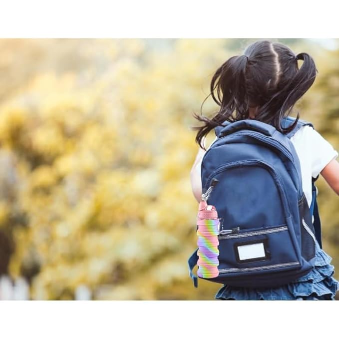 Rainbow silicone expandable water bottle stored in bag's mesh holder – eco-friendly and space-saving design for travel use.