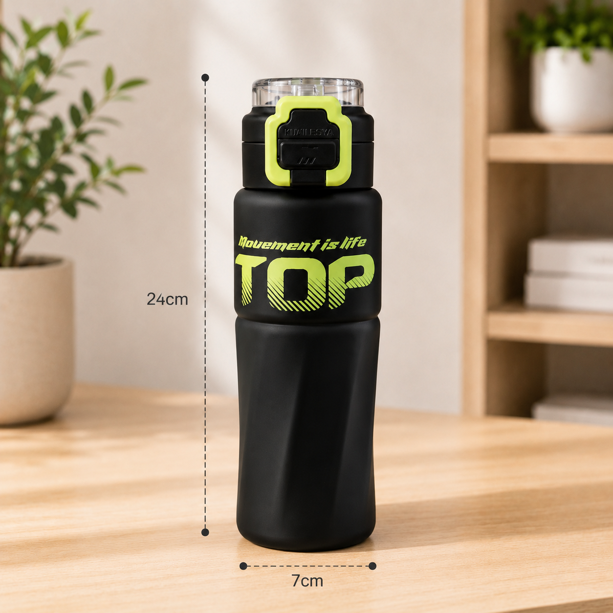 Black water bottle with green text on a wooden table, measurement details included.