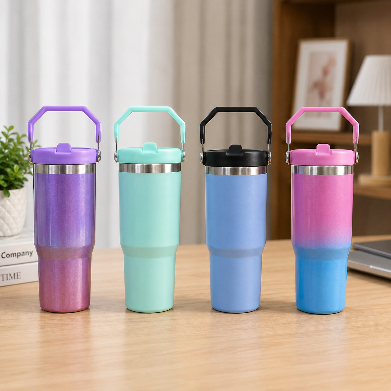 Four gradient-colored tumblers on a wooden surface with a blurred indoor background.