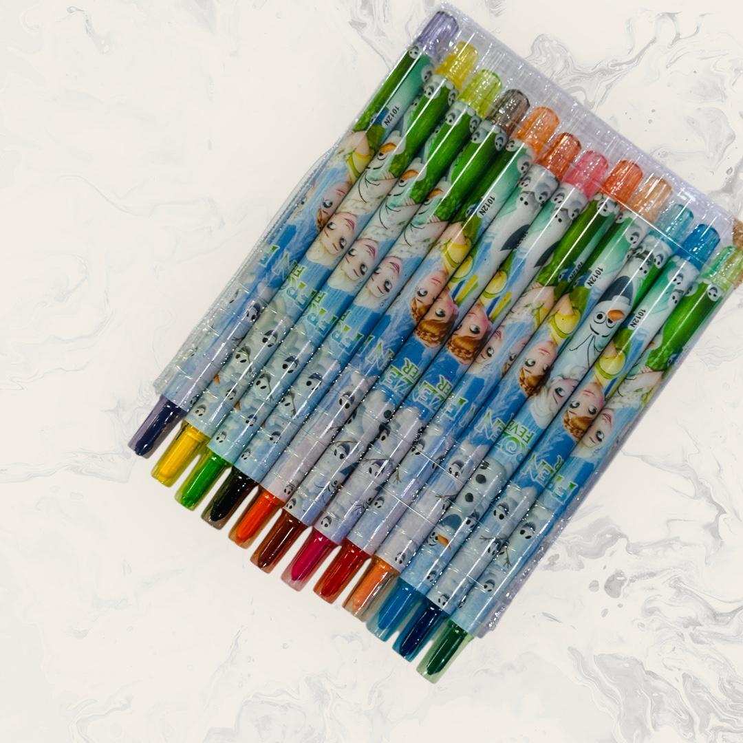 Set of colorful crayons with cartoon character design on a white background