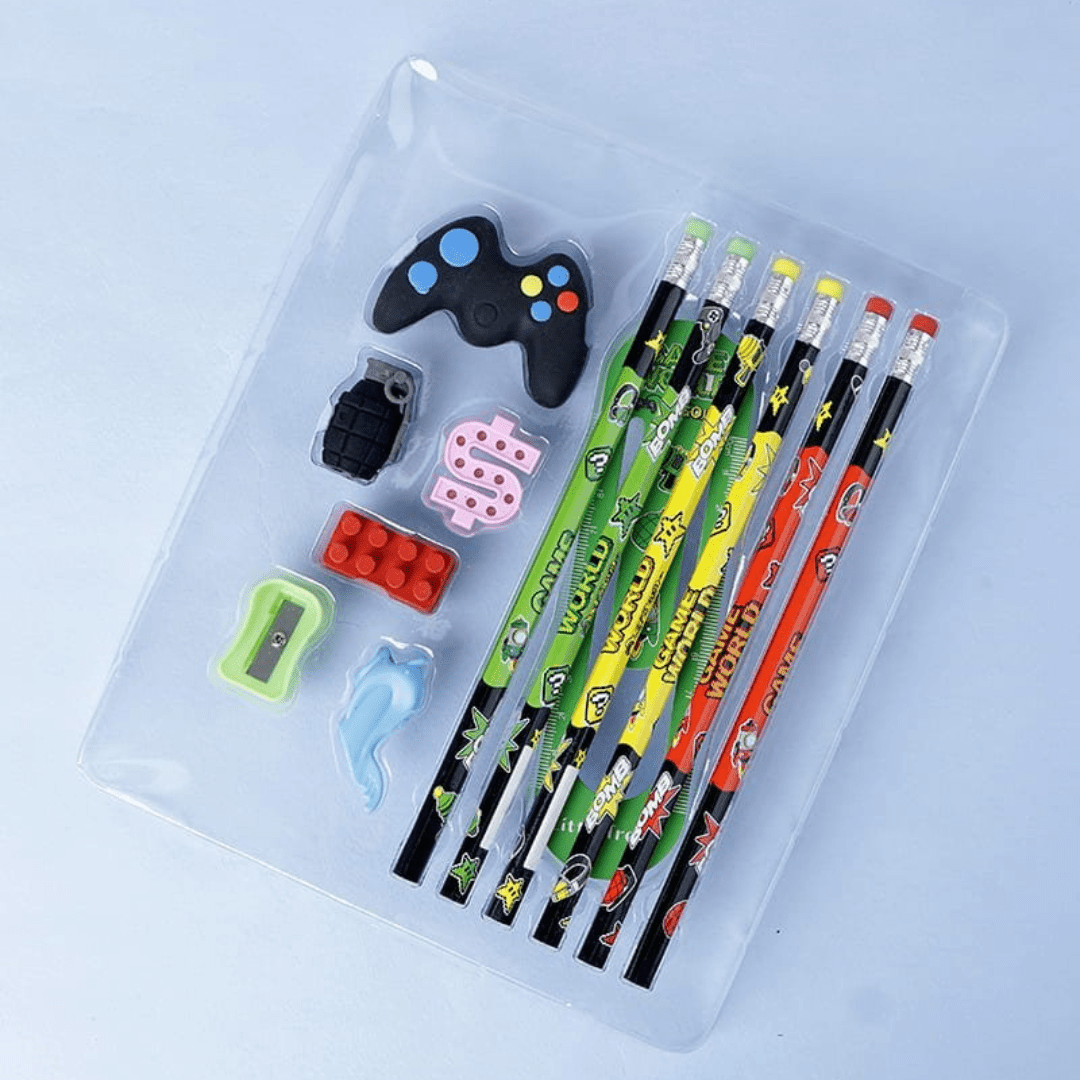 Set of colorful pencils with cartoon designs on a clear tray, including a game controller and toy figure.
