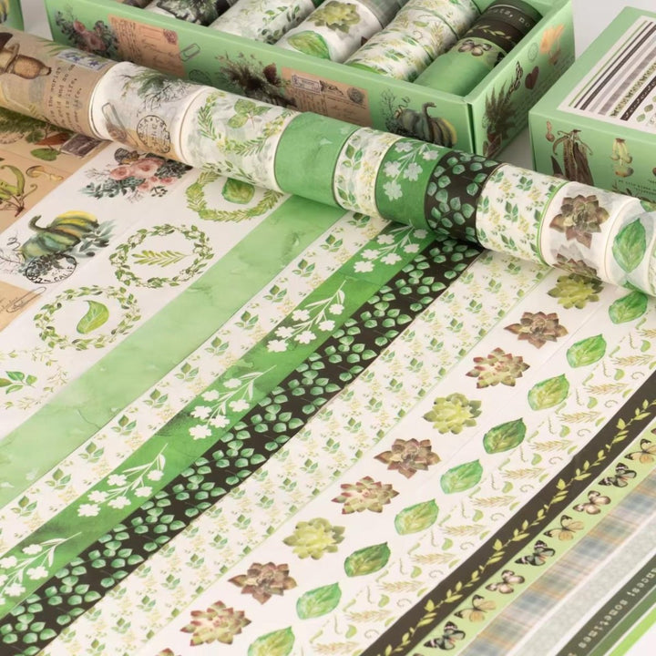 Green Botanical Washi Tape Set - 18 RollsDecorative Washi TapeCRAFTY CUDDLECollection of washi tape rolls with green and nature - themed designs on a wooden surface.washitape washitapelove washitapeaddict botanicalstationery natureinspired greenaesthetic journaling junkjournal artjournaling scrapbooking creativejournaling aestheticstationery stationerylovers