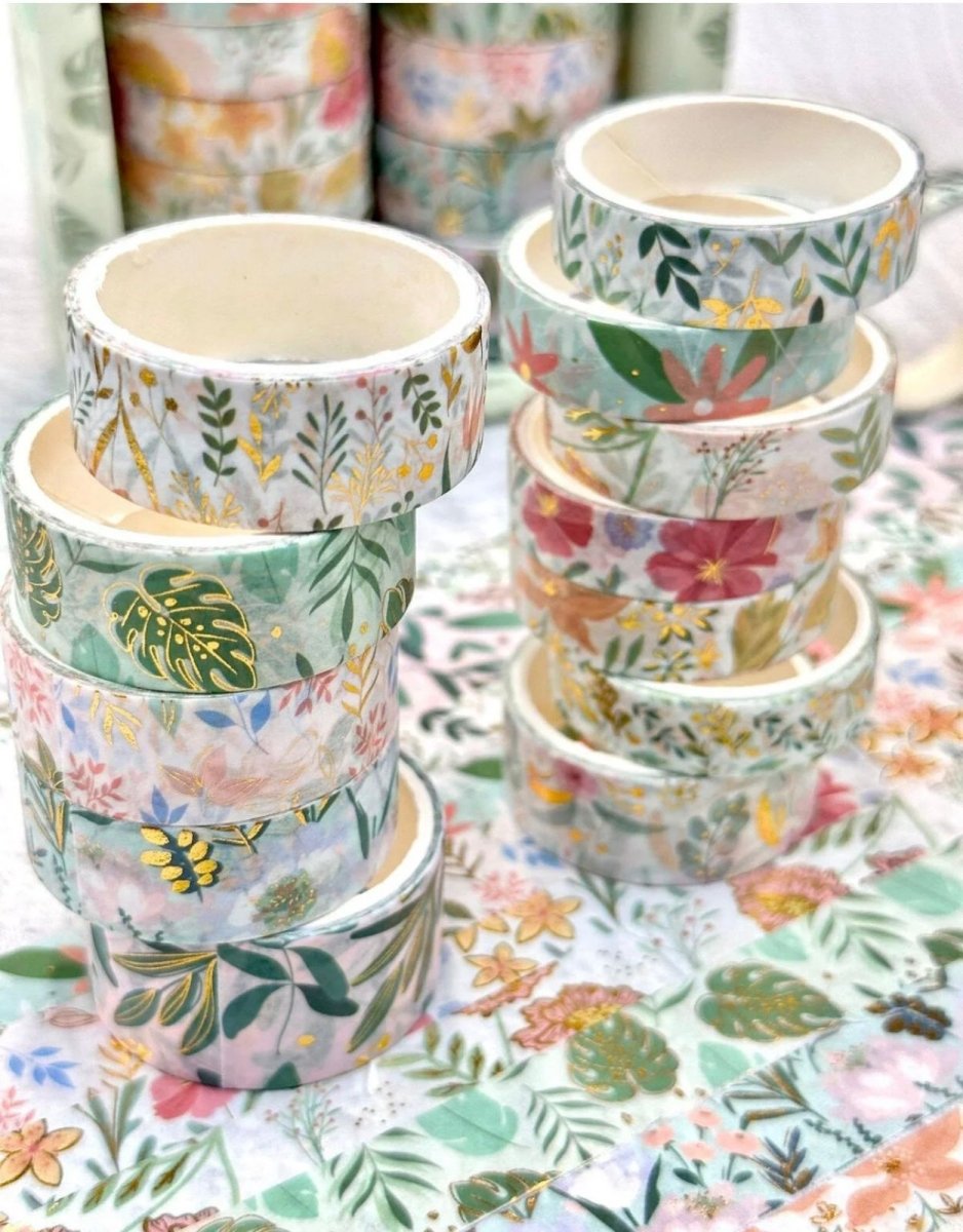 Green Floral Washi Tape SetDecorative Washi TapeCRAFTY CUDDLEStacks of decorative washi tape with floral patterns on a floral backgroundart journalingbotanical tape
