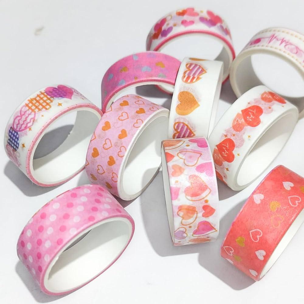 Decorative pink washi tape collection for scrapbooking and DIY crafts"