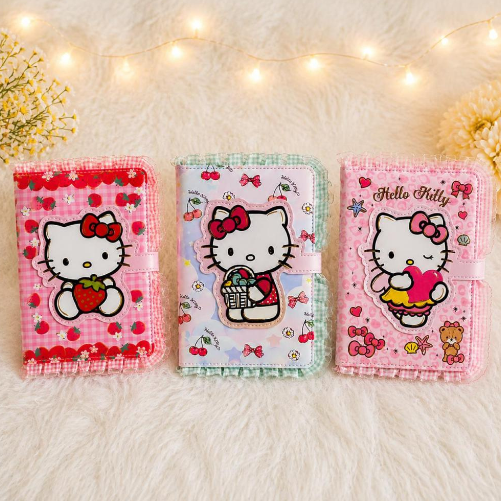 Hello Kitty Magnetic Closure DiaryDiaryCrafty CuddleThree Hello Kitty - themed diaries on a soft surface with decorative lights in the backgroundHelloKitty HelloKittyDiary KawaiiStationery CuteDiary NotebookLove JournalAddict StationeryAddict AestheticStationery GiftForGirls SchoolSuppliesStationeryAddict