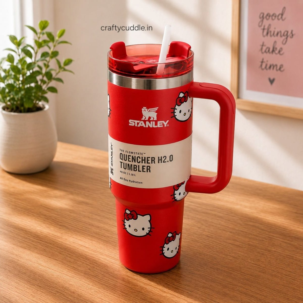 Hello Kitty Stainless Steel TumblerTumblersCrafty CuddleA red Stanley Quenchner H2.0 travel tumbler with a Hello Kitty pattern, featuring a built-in red handle and a white straw, set on a wooden table.CreamHello Kitty Tumbler