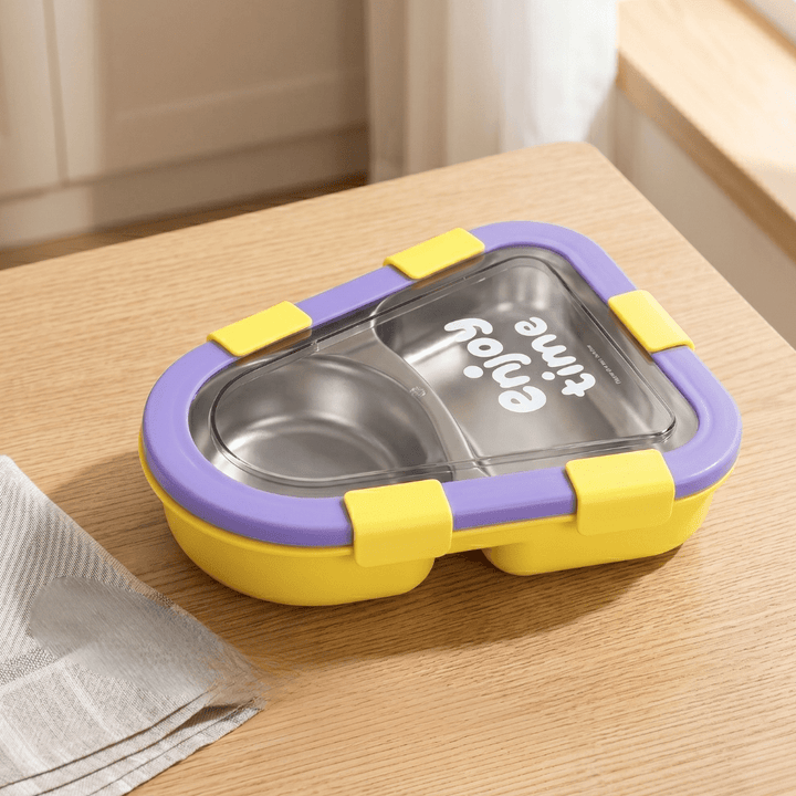 Kids 2 Compartment Lunch Box with Spoon &amp; ForkStainless Steel Lunch BoxCrafty CuddleYellow and purple food container on a wooden surfaceYellowKidsLunchBox BentoBox LunchBox SchoolLunch KidsEssentials LunchBoxIdeas BackToSchool LeakproofLunchBox KidsLunch TiffinBox