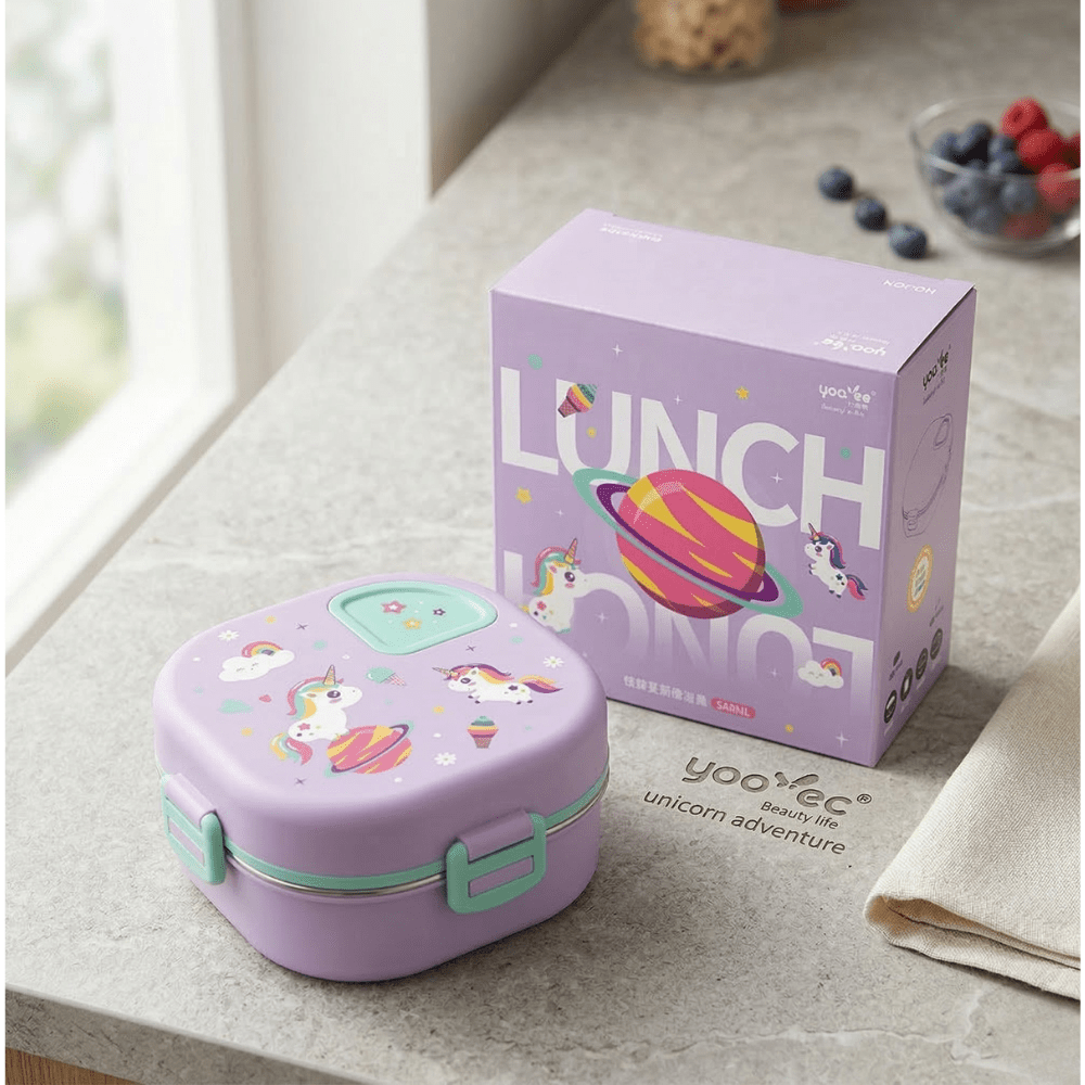 Kids Cartoon Stainless Steel Bento Lunch BoxStainless Steel Lunch BoxCrafty CuddlePurple lunch box with unicorn design next to its packaging on a table.Purplekidslunchbox bentolunchbox schoollunch kidslunch lunchboxforkids cartoonlunchbox unicornlunchbox dinosaurlunchbox schoolessentials kidsproducts