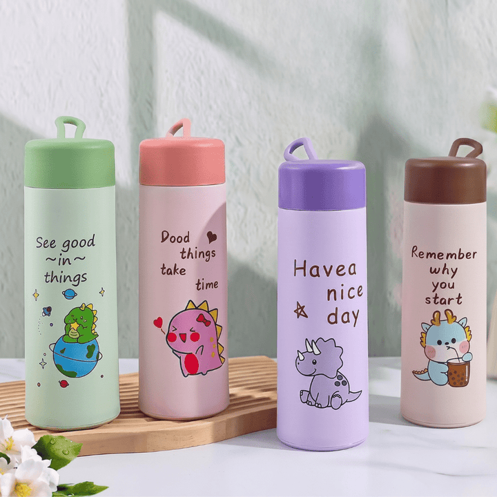 Kids Glass Water BottleCartoon Kids Water BottleCrafty CuddleFour colorful water bottles with motivational quotes and cartoon designs on a light background.Pink