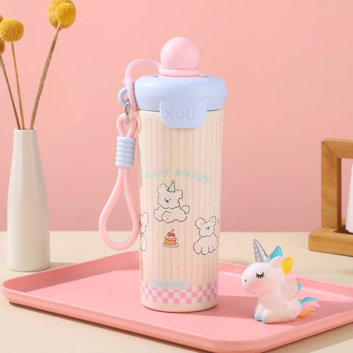Kids Insulated Water BottleCartoon Kids Water BottleCrafty CuddleA cute pink and white striped water bottle with cartoon bear illustrations, a pink loop strap, and a light blue lid, displayed on a pink tray next to a small unicorn figurine.PinkStainlessSteelBottle InsulatedBottle WaterBottle KidsWaterBottle LeakproofBottle ReusableBottle SchoolEssentials TravelBottle HydrationOnTheGo CuteWaterBottle