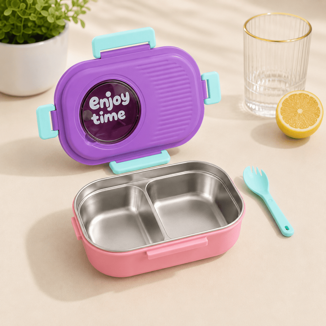 Leakproof Bento Lunch BoxStainless Steel Lunch BoxCrafty CuddleA pink and purple stainless steel bento lunch box set with a light blue lid and matching light blue utensil, shown on a beige tabletop with a glass, lemon half, and potted plant in the background.PurpleLunchBox BentoBox StainlessSteelLunchBox LeakproofLunchBox KidsLunchBox TiffinBox SchoolEssentials OfficeLunch KitchenEssentials LunchGoals