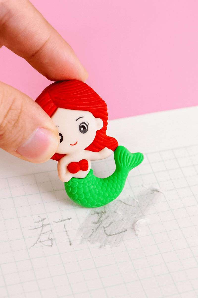 Mermaid ErasersErasersCRAFTY CUDDLEMermaid figurine eraser held by a hand on a pink and white background1CreativeStationeryCuteErasers