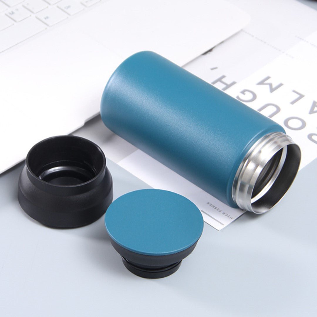 350ml teal blue insulated vacuum cup with black lid, sleek stainless steel thermal bottle for hot and cold drinks.