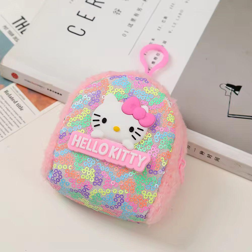 Mini Sequin Coin Pouch for KidsCoin pouchCRAFTY CUDDLEHello Kitty sequined pouch on a surface with books in the backgroundPinkSequinPouch CuteAccessories KidsAccessories CoinPouch GlitterPouch ReturnGiftIdeas KawaiiStyle MiniPouch StationeryLovers TrendyKids