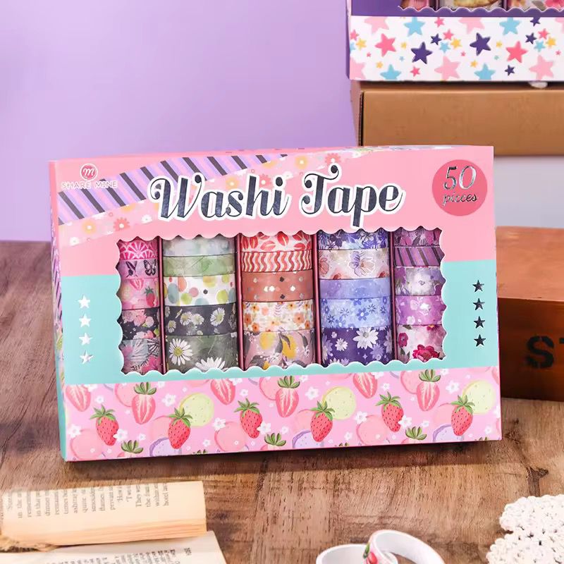 Pastel Floral Washi Tape – 50 RollsDecorative Washi TapeCRAFTY CUDDLEBox of Washi tape with colorful designs on a wooden surfacewashitape washitapelove washitapecollection papercrafts diycrafts journaling bulletjournal plannerdecor creativejournaling stationerylovers aestheticstationery